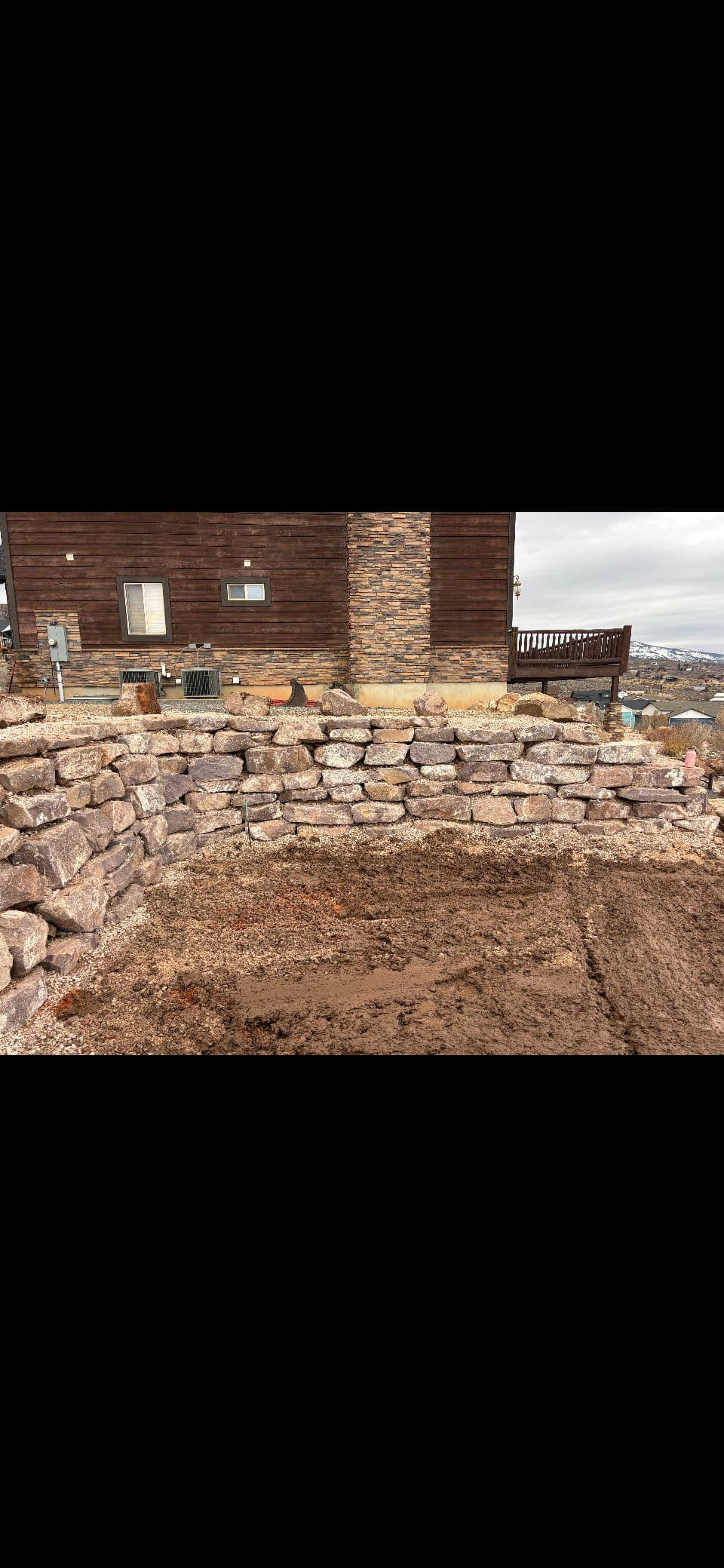 Rock Retaining Wall Built to Hold Its Ground image